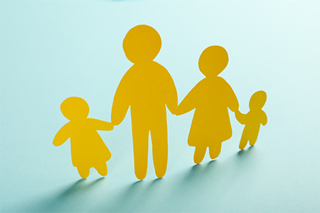 paper cut family holding hands - concept