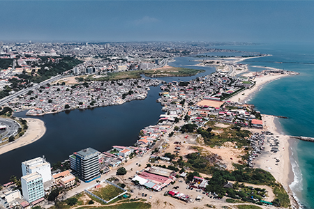 An aerial perspective reveals the coastal with contrasting urban structures and waterfront developme