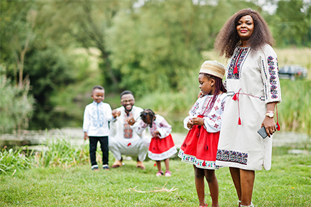 African family in traditional clothes at park
