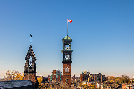 Church and Clocktower with Canadian Flag - Toronto, Ontario, Canada