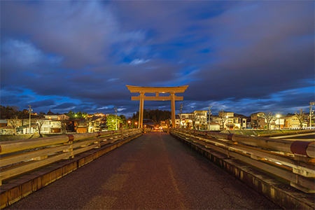 Japanese Torii pole at Miyamae Bridge at night in Takayama old town, Gifu, urban city in Japan