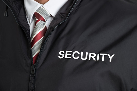 Close-up Of Security Guard Wearing Uniform With The Text Security