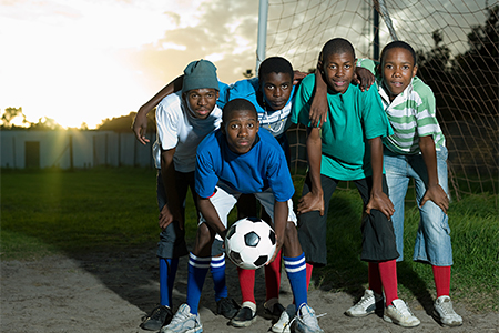group photo of teenage boys on football pitch