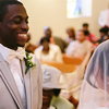 Bridegroom in church wedding ceremony smiling at bride