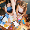 elementary students sitting on table learning