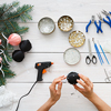 Top view of leisure, tools for creating holiday decorations, pliers, glue gun and scissors