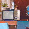 The old television and fan with household equipment in retro items inside of vintage house