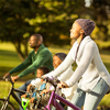 young family doing a bike ride on an autumns day