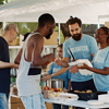 Volunteer team graciously providing warm meals