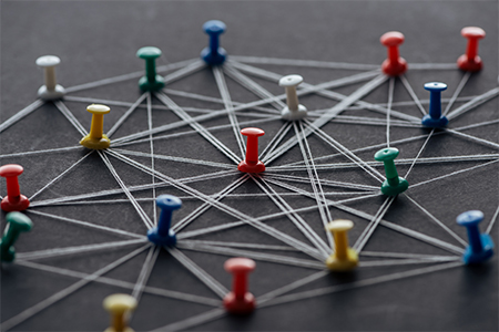 colorful pins connected with strings isolated on grey