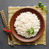 Top view of Boiled rice, chopsticks and bamboo napkin