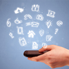 hand holding mobile phone with drawn social media icons