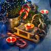 Christmas toy sledge, candy canes, candles and spruce branches