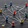 colorful pins connected with strings isolated on grey