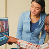 Creative filmmakers doing teamwork to edit video footage in agency studio