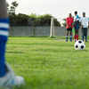 Friends playing football