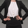 businesswoman standing with hands, isolated on grey background