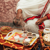 African woman making traditional coffee