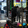 Modern gym interior with sports training equipment on rack