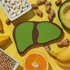 Paper liver, nuts, fruits and beans on yellow background, top view