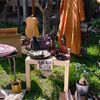 Used items and clothes for garage sale in front yard