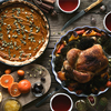 Wooden table served for Thanksgiving dinner top view
