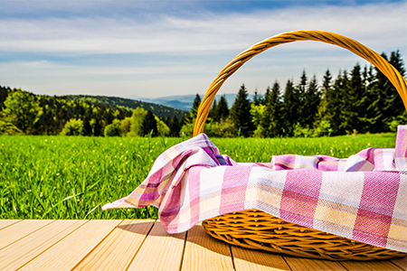 A charm-filled picnic spot, a crafted basket rests on a wooden table