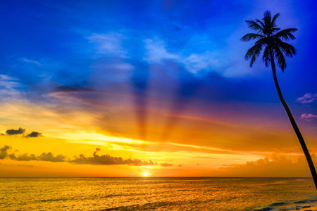 a striped high lighthouse stands on the shores of the Caribbean Dominican Republic for the safety of