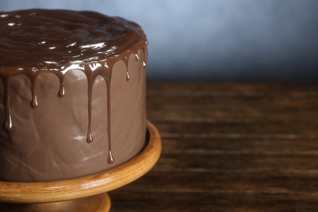 Delicious chocolate cake on the wooden surface. 3d render