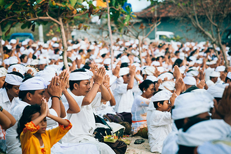 BALI, Indonesia - MAR 9, 2013: Local people during performed Melasti Ritual. Melasti is a Hindu Bali