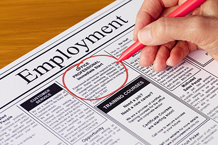 newspaper with employment opportunities circled