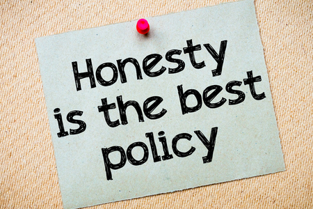 Honesty Is The Best Policy Message. Recycled paper note pinned on cork board. 