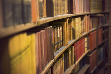 Library or book store with rows of old antique books