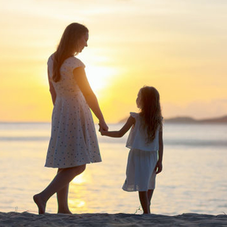 Motherhood - Image of mother and baby playing outdoors