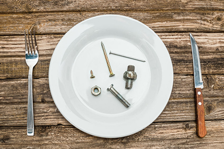 Hardware dinner on plate from screw, bolt and nut