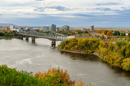 Autumn view of Ottawa River and Alexandra Bridge in Ottawa, Canada. Seen from Parliament Hill