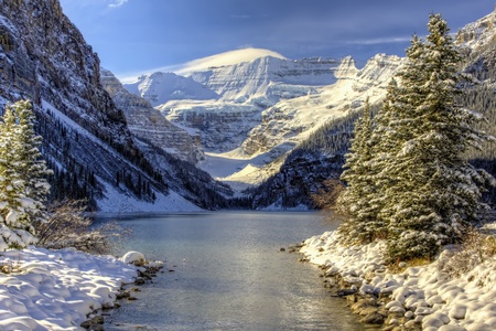Early winter snow settles on Lake Louise, Alberta in the Canadian Rockies