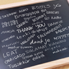 Thank you gratutide words letter in many languages, written on blackboard. Motivational business typ