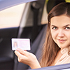 A girl showing her driving license