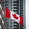 Canadian flag in front of a residential condo appartment building in Montreal, Quebec, Canada.