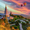 Colorful hot air balloons flying over two pagoda in Doi Inthanon Mountain in Chiang Mai, Thailand, H