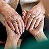 Cropped shot of a senior woman holding hands 
