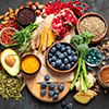 Healthy food clean eating selection on dark background. Balanced diet concept. Superfood assortment.