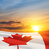 Canada national flag waving on sunset sky. Canada day. 3d rendering.