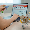 Online shopping-boxes or parcels are placed on the table and shopping carts