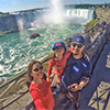 Michael, his wife and daughter taking a selfie over Niagara Falls