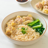egg noodles with pork wonton soup or pork dumplings soup and vegetable - Asian food style