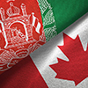 Afghanistan and Canada flags together textile cloth, fabric texture