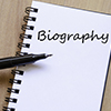 notepad and pen with biography written 