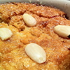 close up of basbousa cake topped with almonds